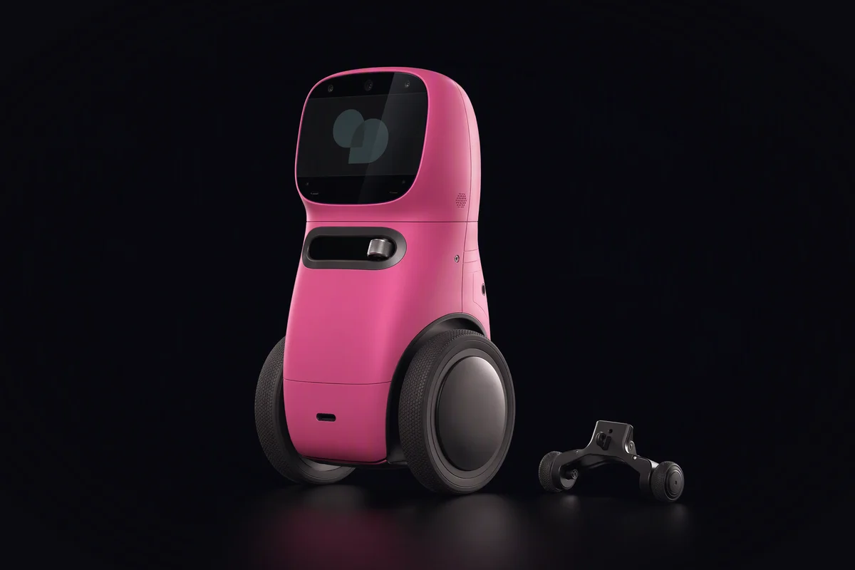 Mały dwukołowy robot balansujący samodzielnie, obok leżą jego odczepione kółka podporowe